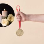 medaglia d'oro e candela