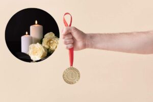 medaglia d'oro e candela
